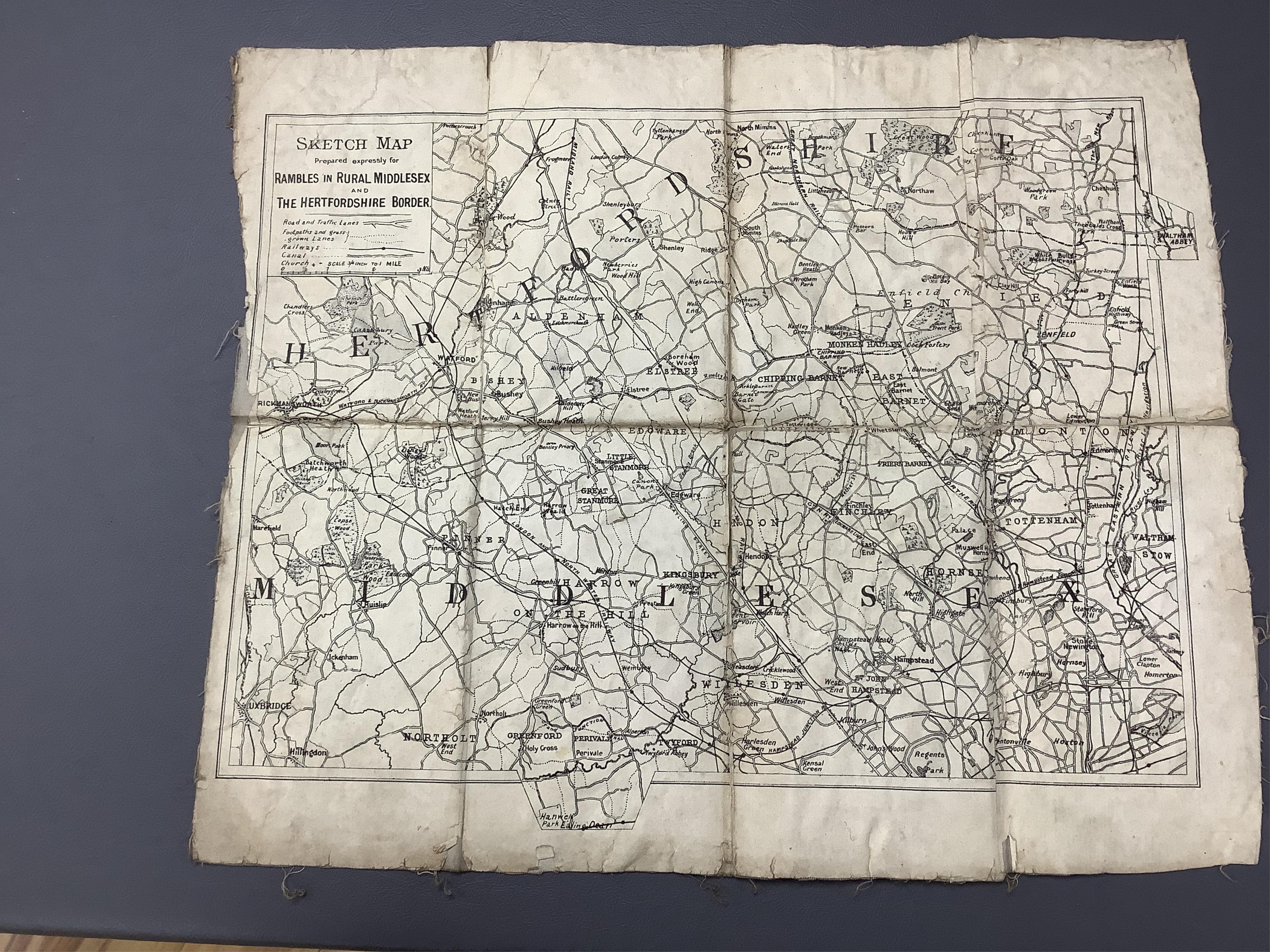 Three maps comprising: After John Senex, A New Map of London, 1720, published by Cassell, Petter & Galpin, linen backed folding map, with slipcase, London in the Reign of Queen Elizabeth, published by Cassell, linen back